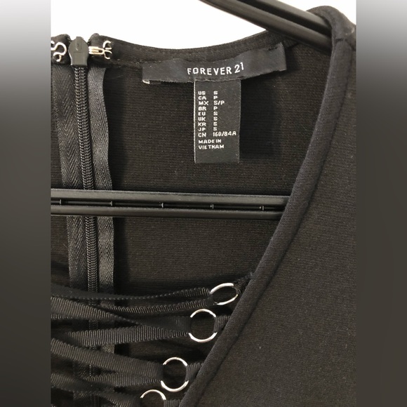 Cute black mini-dress with laced front & sheer sleeves - Picture 2 of 5